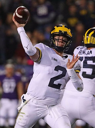 Shea Patterson (2) and Jon Runyan Jr. (75)