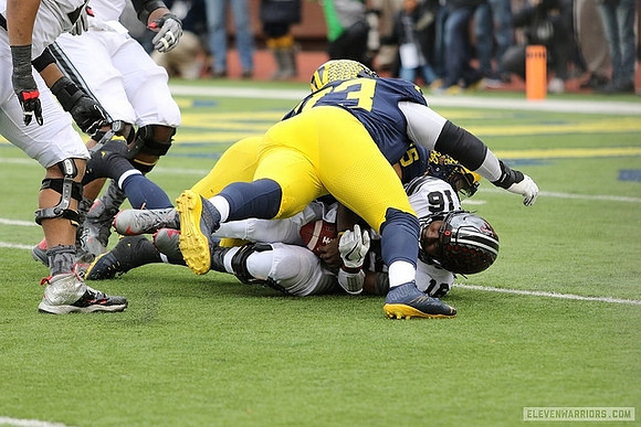 Maurice Hurst (73) and Chase Winovich (15)