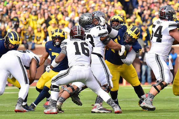 Khaleke Hudson (7) and Maurice Hurst (73)