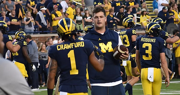 Khalid Hill (80), Cesar Ruiz (51), Kekoa Crawford (1), Wilton Speight (3), Zach Gentry (83),  Brad Robbins (3), and Henry Poggi (19)