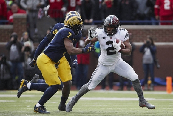 Khaleke Hudson (7) and Mike McCray (9)