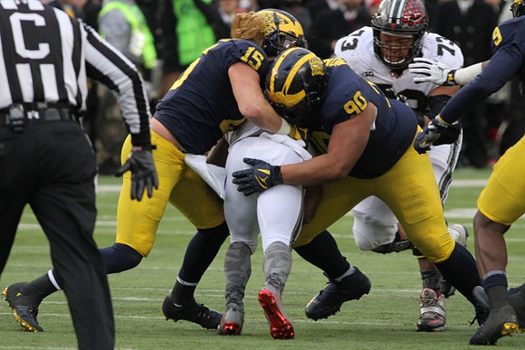 Chase Winovich (15), Bryan Mone (90), and Mike McCray (9)