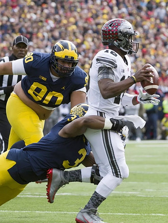 Bryan Mone (90) and Rashan Gary (3)