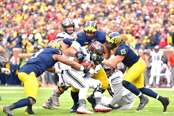 Rashan Gary (3), Bryan Mone (90), and Chase Winovich (15)