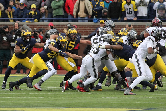 Khaleke Hudson (7), J'Marick Woods (26), Chase Winovich (15), and Rashan Gary (3)
