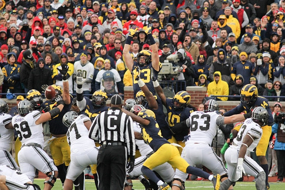 Aubrey Solomon (5), Maurice Hurst (73), Lavert Hill (24), Devin Bush (10), and Josh Metellus (14)