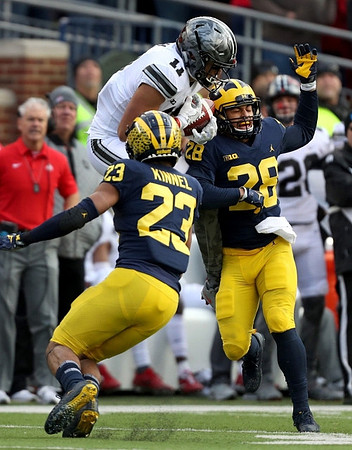 Tyree Kinnel (23) and Brandon Watson (28)