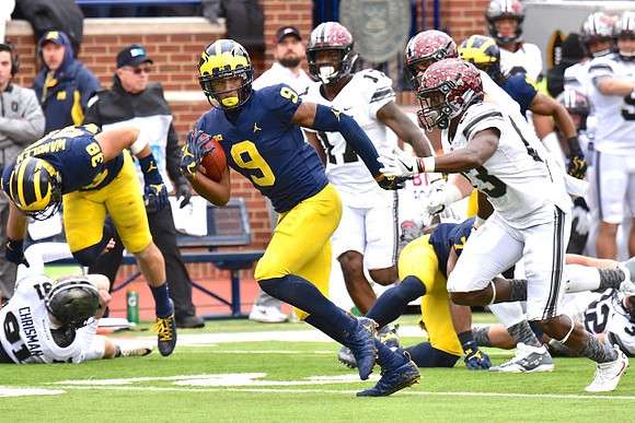 Jared Wangler (38), Donovan Peoples-Jones (9), and Khaleke Hudson (7)