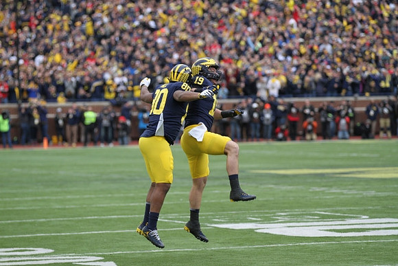 Khalid Hill (80) and Henry Poggi (19)