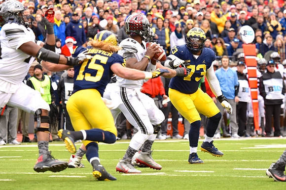 Chase Winovich (15) and Maurice Hurst (73)