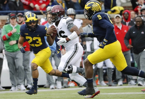 Tyree Kinnel (23) and Mike McCray (9)