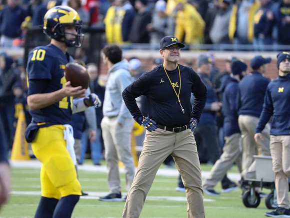 Dylan McCaffrey (10) and Jim Harbaugh