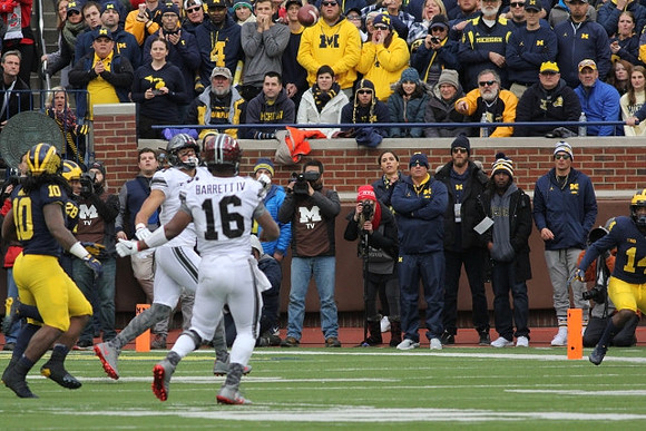 Devin Bush (10), Brandon Watson (28), and Josh Metellus (14)