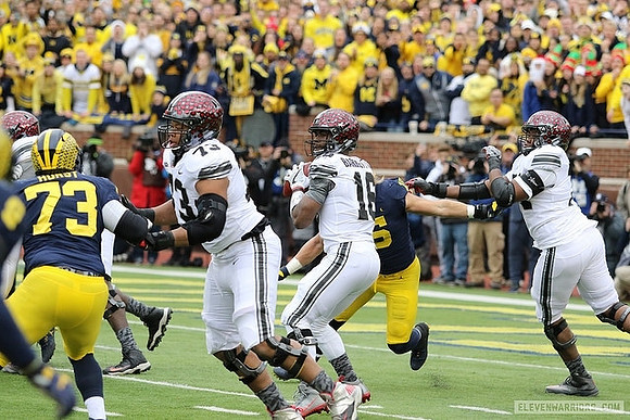 Maurice Hurst (73) and Chase Winovich (15)