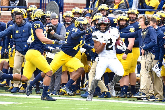 Tyree Kinnel (23) and Josh Metellus (14)