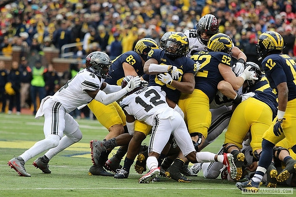 Zach Gentry (83), Khalid Hill (80), Mason Cole (52), Ben Bredeson (74), and Chris Evans (12)