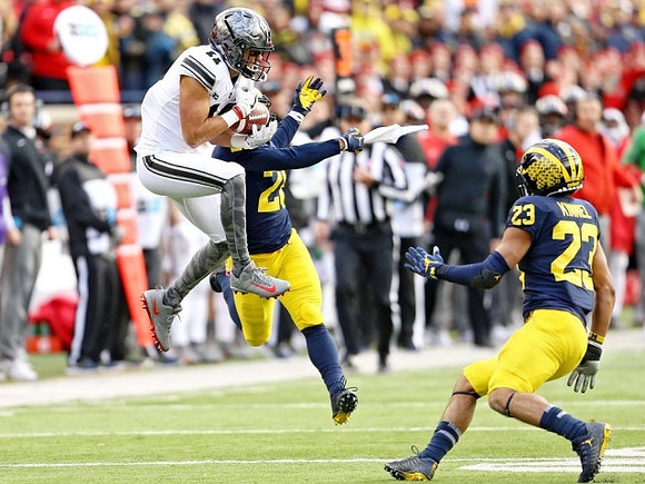 Brandon Watson (28) and Tyree Kinnel (23)