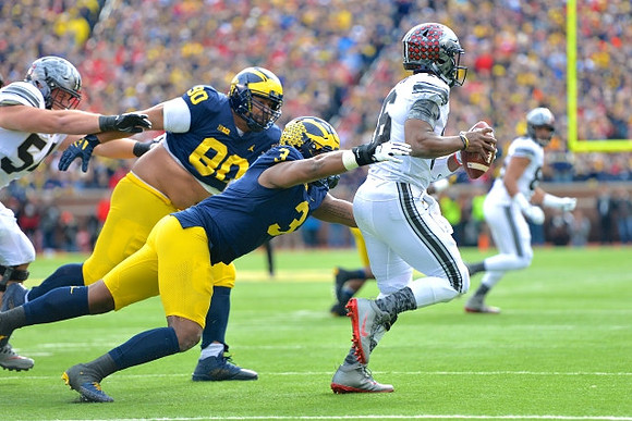 Bryan Mone (90) and Rashan Gary (3)