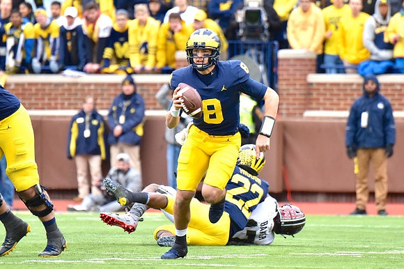 John O'Korn (8) and Karan Higdon (22)