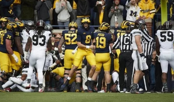 Ben Bredeson (74), Cesar Ruiz (51), Mason Cole (52), John O'Korn (8), Henry Poggi (19), and Tyrone Wheatley Jr. (17)