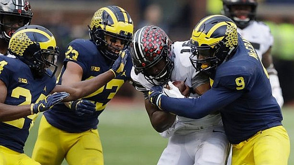 Lavert Hill (24), Tyree Kinnel (23), and Mike McCray (9)