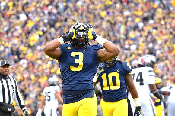 Rashan Gary (3) and Devin Bush (10)
