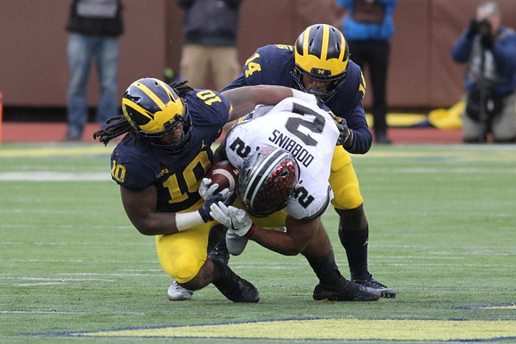 Devin Bush (10) and Josh Metellus (14)