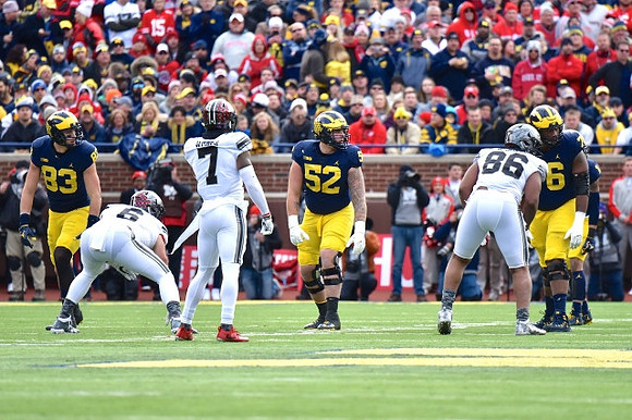 Zach Gentry (83), Mason Cole (52), and Juwann Bushell-Beatty (76)
