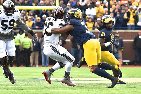 Rashan Gary (3) and Devin Bush (10)