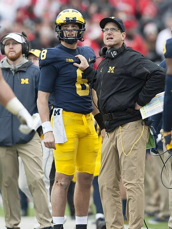 Jay Harbaugh, John O'Korn (8), and Jim Harbaugh