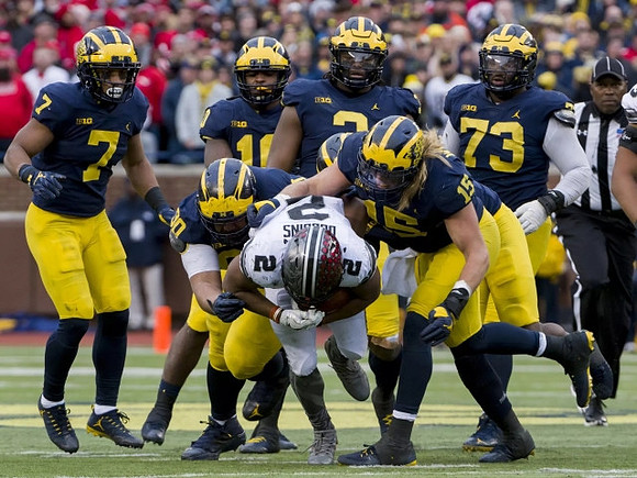 Khaleke Hudson (7), Bryan Mone (90), Devin Bush (10), Rashan Gary (3), Chase Winovich (15), and Maurice Hurst (73)