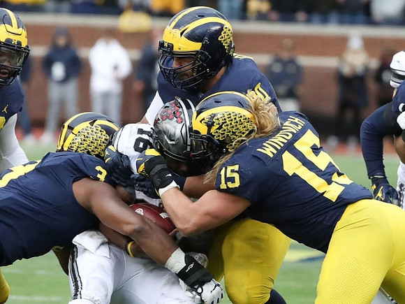 Rashan Gary (3), Chase Winovich (15), and Bryan Mone (90)