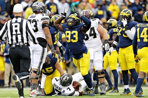 Chase Winovich (15), Devin Bush (10), Lawrence Marshall (93), David Long (22), Maurice Hurst (73), and Josh Metellus (14)