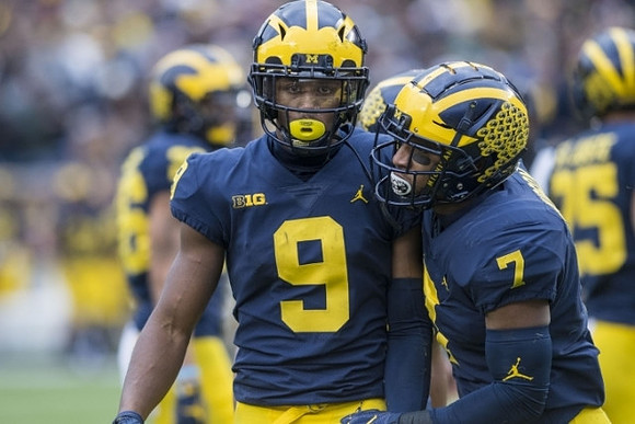 Donovan Peoples-Jones (9) and Khaleke Hudson (7)