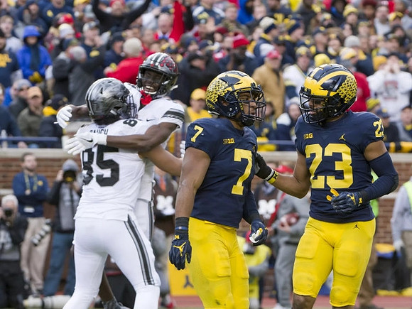 Khaleke Hudson (7) and Tyree Kinnel (23)