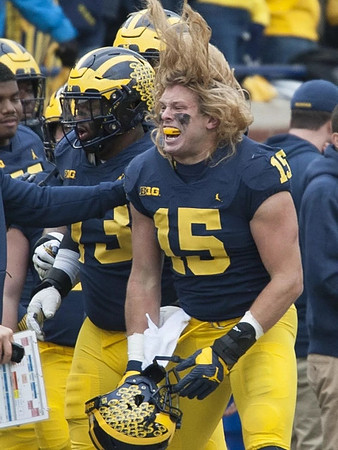 Maurice Hurst (73) and Chase Winovich (15)