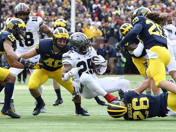 Benjamin St-Juste (25), Michael Wroblewski (46), J'Marick Woods (26), Brandon Watson (28), and Rashan Gary (3)