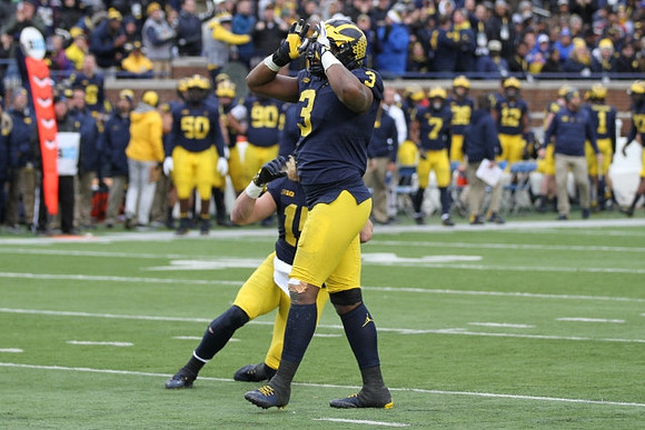 Chase Winovich (15) and Rashan Gary (3)