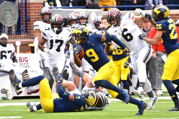 Khaleke Hudson (7), Donovan Peoples-Jones (9), and J'Marick Woods (26)
