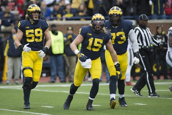 Noah Furbush (59), Chase Winovich (15), and Maurice Hurst (73)