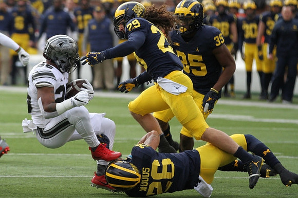 J'Marick Woods (26), Jordan Glasgow (29), and Josh Uche (35)