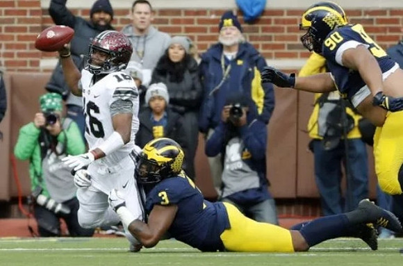 Rashan Gary (3) and Bryan Mone (90)