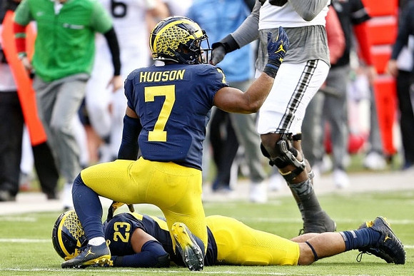 Khaleke Hudson (7) and Tyree Kinnel (23)