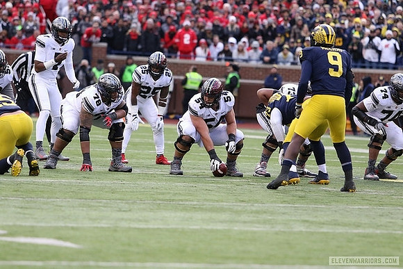 Maurice Hurst (73) and Mike McCray (9)