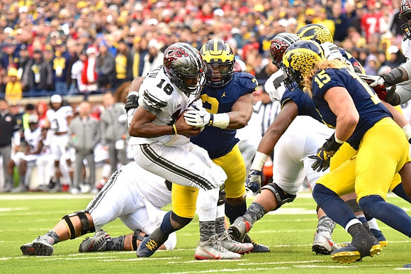 Rashan Gary (3) and Chase Winovich (15)