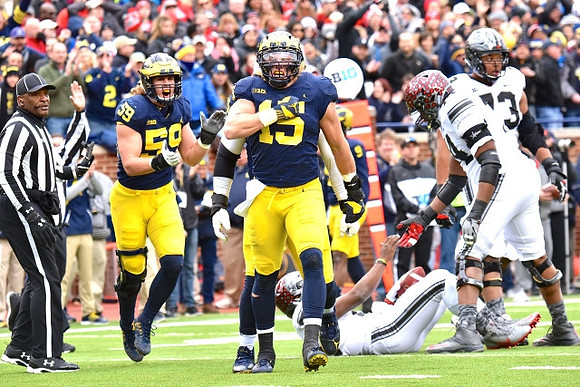 Noah Furbush (59) and Chase Winovich (15)