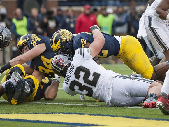 Sean McKeon (84) and Karan Higdon (22)