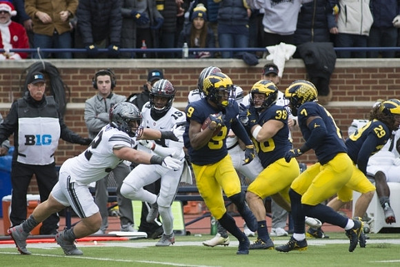 Donovan Peoples-Jones (9), Jared Wangler (38), Khaleke Hudson (7), and Jordan Glasgow (29)