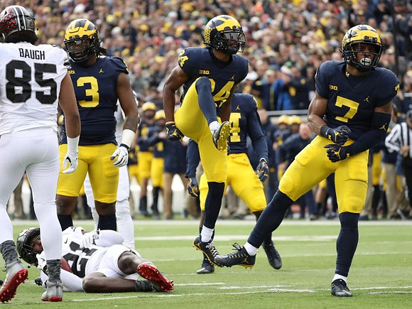 Rashan Gary (3), Lavert Hill (24), Josh Metellus (14), and Khaleke Hudson (7)