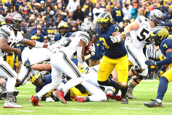 Rashan Gary (3) and Khaleke Hudson (7)